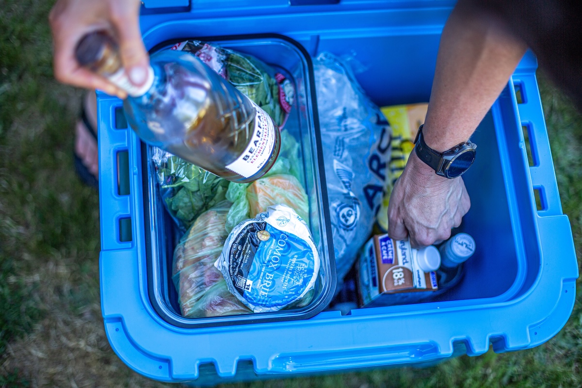 A cooler is filled with ice and food at the optimum 2:1 ratio.