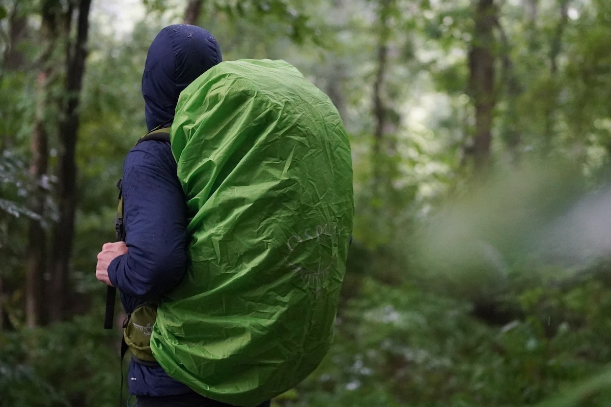 Waterproof pack cover in a rain storm